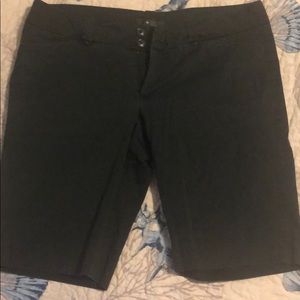 Black Bermuda shorts.